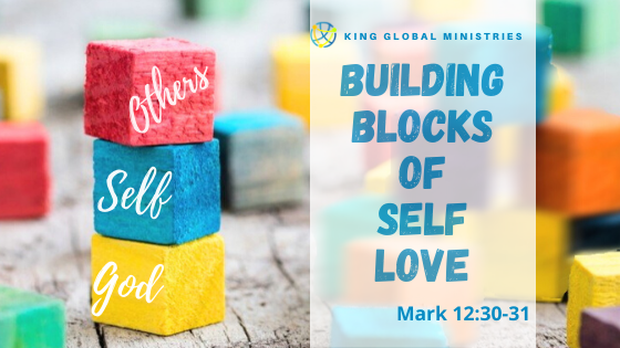 three stacked building blocks with God, Self, and Others written on a block